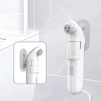 Safarex white bidet sprayer mounted with a suction cup on a tiled bathroom wall
